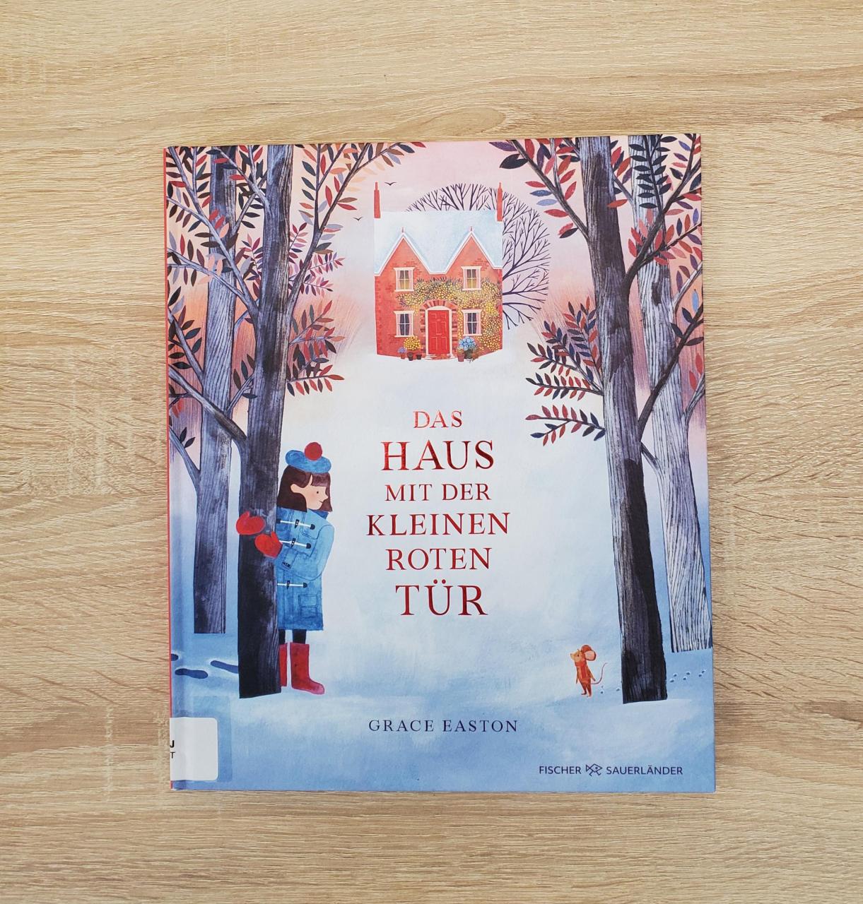 Buch mit Schnee und Mädchen am Cover